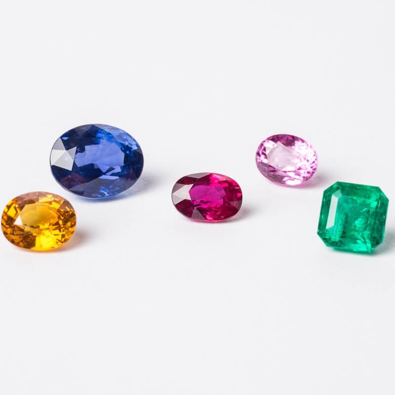 2026-10-20_MT_Web_Home_Card3_Curated-Stones a selection of loose coloured gemstones